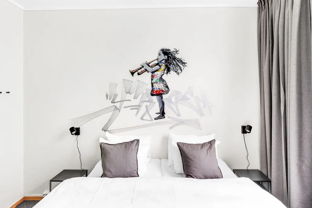 Standard room with bed and bedside table