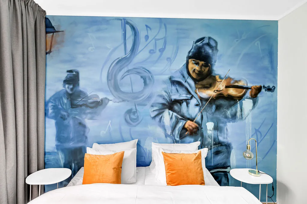 Standard room with street art and light furniture
